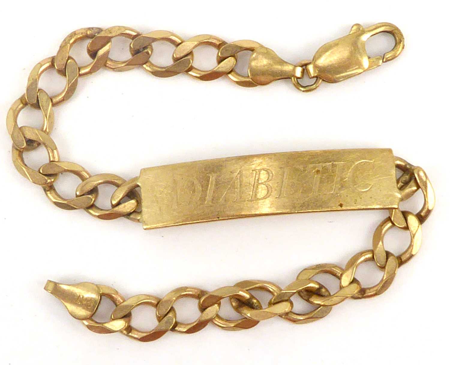 Lot 1023 - A 9ct gold identity bracelet with central...