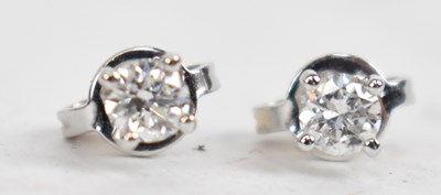 Lot 692 - A pair of 18ct white gold diamond solitaire...