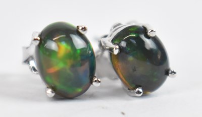 Lot 738 - A pair of silver ear studs set with cabochon...