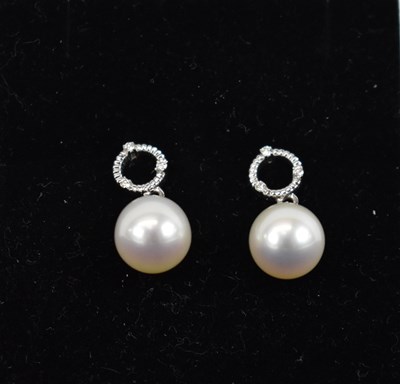 Lot 706 - A pair of 9ct white gold pearl and diamond...