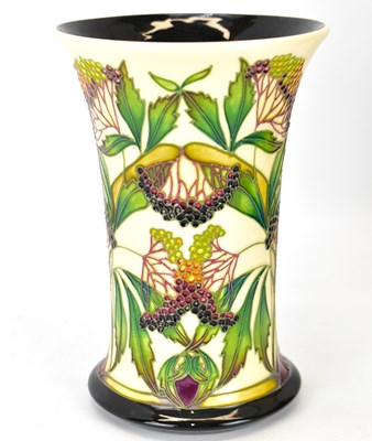 Lot 403 - MOORCROFT; an 'Elderberry' pattern vase of...