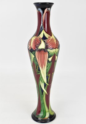 Lot 410 - MOORCROFT; a 'Trinity' pattern vase of slender...