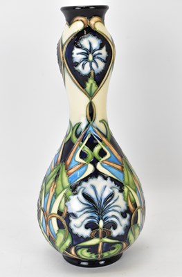 Lot 415 - MOORCROFT; a 'Centaurea' pattern vase of gourd...