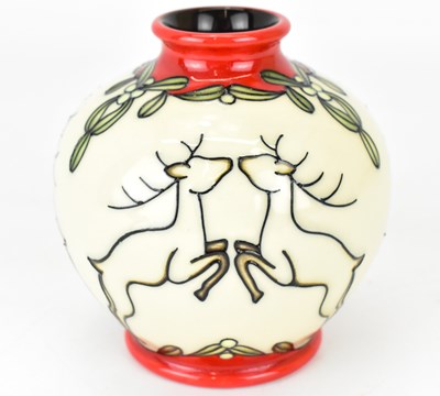 Lot 405 - MOORCROFT; a small tube lined bulbous vase...