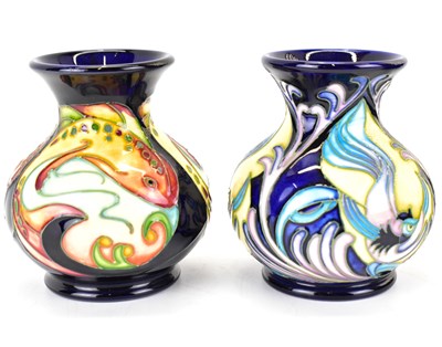 Lot 406 - MOORCROFT; two small baluster vases with...