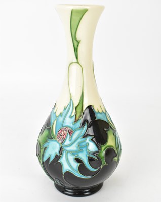 Lot 409 - MOORCROFT; a 'Thistle' pattern vase of bottle...