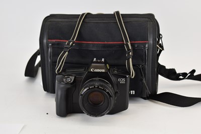 Lot 698 - CANON; an EOS 650 camera, lens and bag.