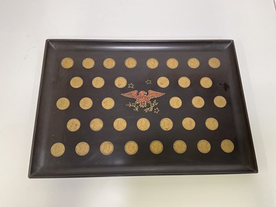 Lot 47 - A Couroc of Monterey tray inserted with coins...