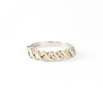 Lot 984 - An 18ct yellow gold half eternity ring set...