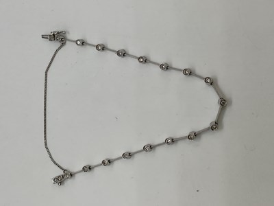 Lot 388 - An 18ct white gold and diamond set bracelet...