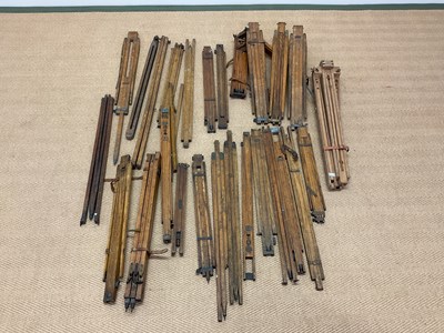 Lot 16 - A huge collection of surveyors' tripods and an...