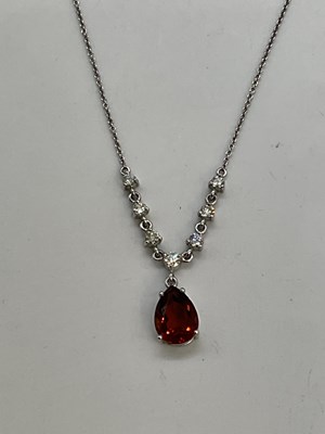 Lot 386 - A diamond and tourmaline white gold necklace,...