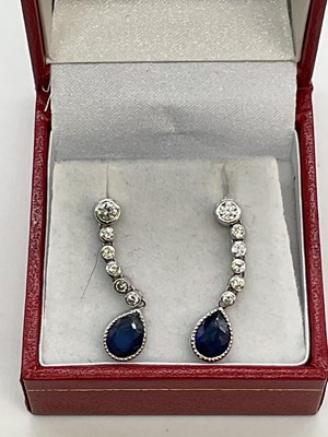 Lot 380 - A pair of 18ct white gold diamond and sapphire...