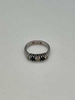 Lot 395 - A 9ct white gold five stone diamond and...