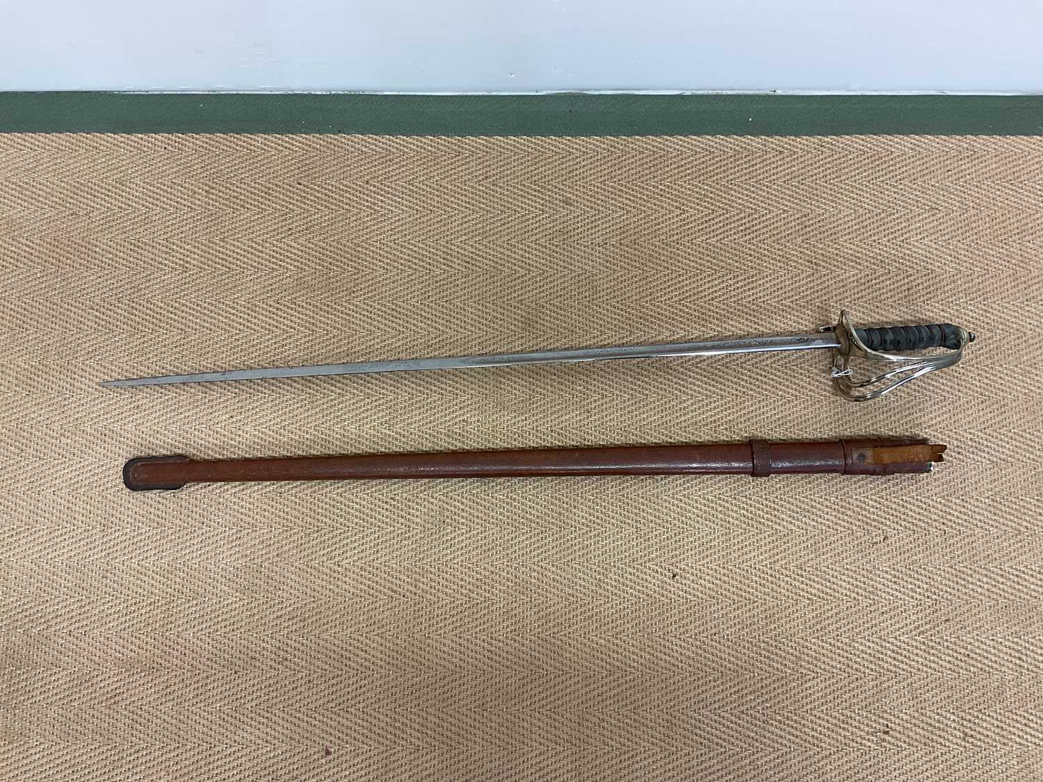 Lot 79 - A Naval Officer's dress sword engraved...