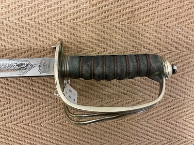 Lot 79 - A Naval Officer's dress sword engraved...