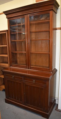 Lot 18 - A late Victorian walnut bookcase with glazed...