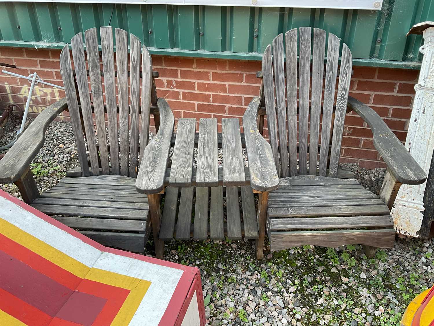 Lot 365 - A wooden companion garden seat, with...