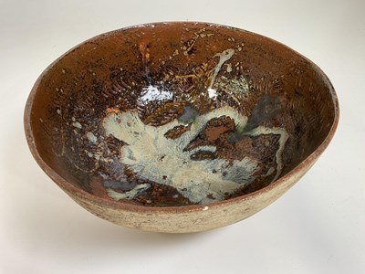 Lot 181 - A studio pottery bowl with brown glaze interior.