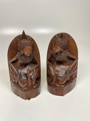 Lot 239 - A pair of carved wooden Thai bookends, height...