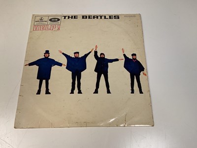 Lot 2106 - THE BEATLES; three records and an empty record...