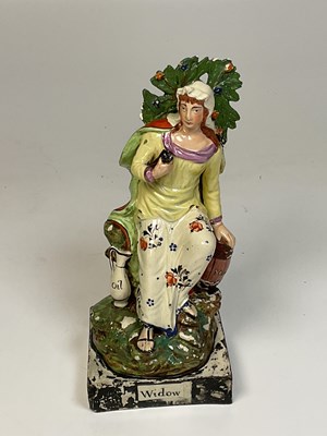 Lot 201 - Staffordshire pottery figure of the Widow