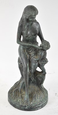 Lot 592 - A verdigris bronze figure of a mother and...