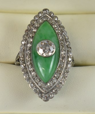 Lot 677 - An Art Deco style diamond and jade navette...