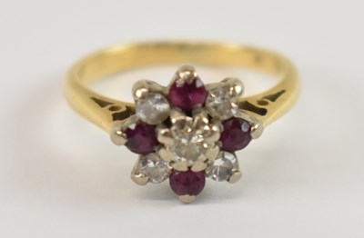 Lot 680 - An 18ct yellow gold diamond and ruby flower...