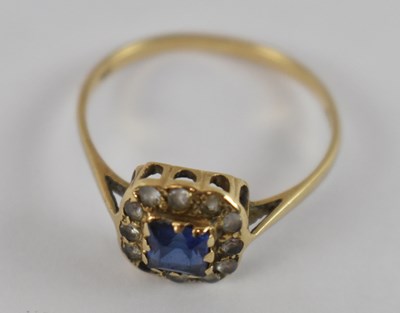 Lot 770 - A 9ct yellow gold dress ring with central blue...