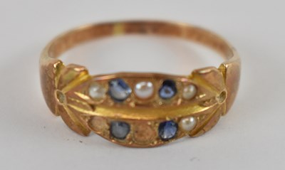 Lot 771 - A yellow metal ring set with blue stones and...