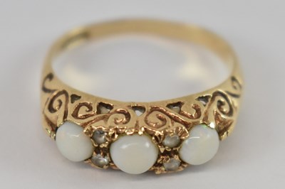 Lot 739 - A yellow metal opal and diamond ring,...