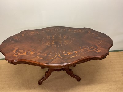 Lot 510 - A Continental inlay marquetry dining table,...