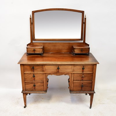 Lot 56 - An Edwardian mahogany kneehole dressing chest,...