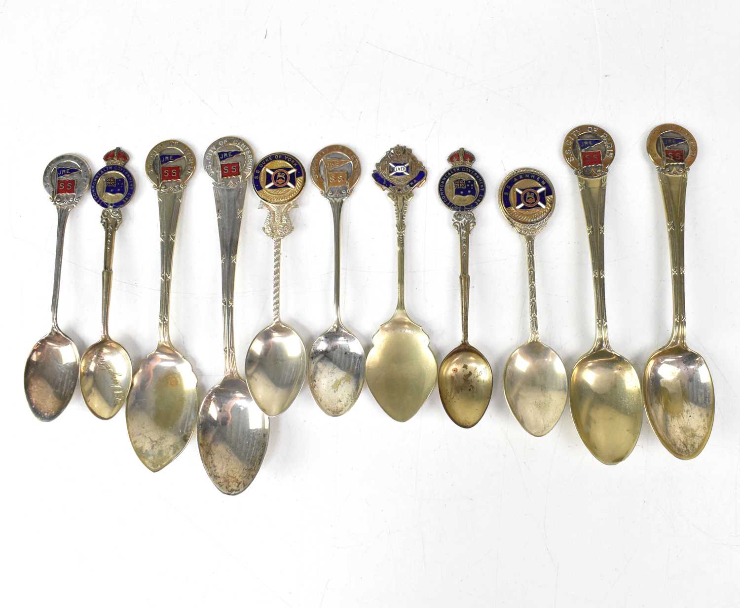 Lot 254 - Eleven souvenir commemorative spoons for...