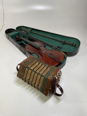 Lot 91 - A violin and a concertina.