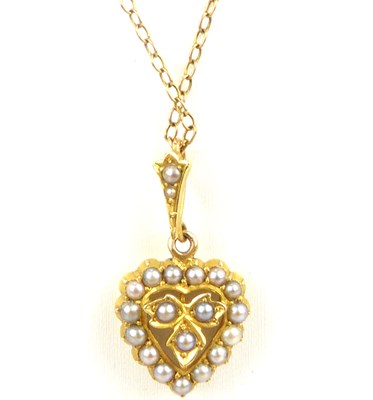 Lot 1084 - A small 15ct gold heart-shaped pendant clad...