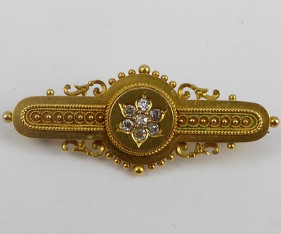 Lot 1044 - A Victorian 9ct gold brooch with a central...