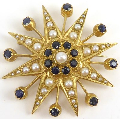 Lot 1035 - A 9ct gold starburst brooch with central pearl...