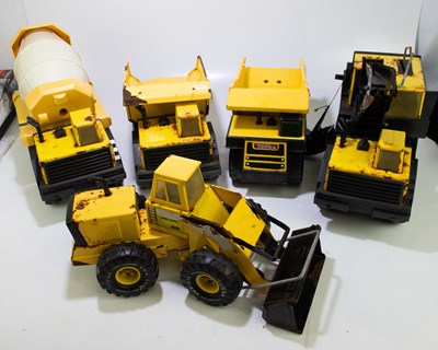 Lot 64 - TONKA; two vintage yellow tipping trucks,...