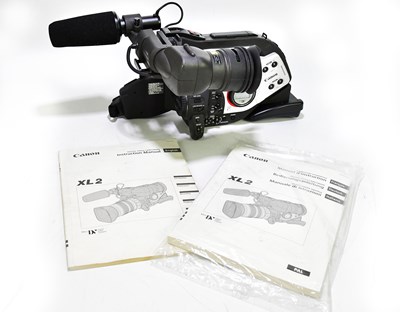 Lot 54 - CANON; an XL2 video camera, together with a...