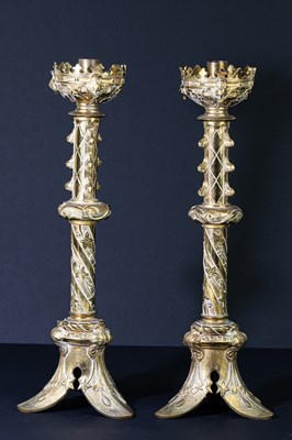 Lot 17 - A pair of decorative brass altar style...