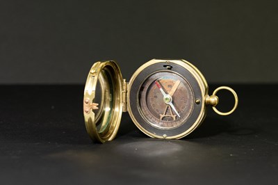 Lot 52 - A modern brass compass, stamped 'Makers to the...