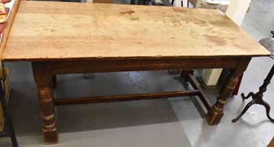 Lot 91 - An oak plank top refectory type table raised...