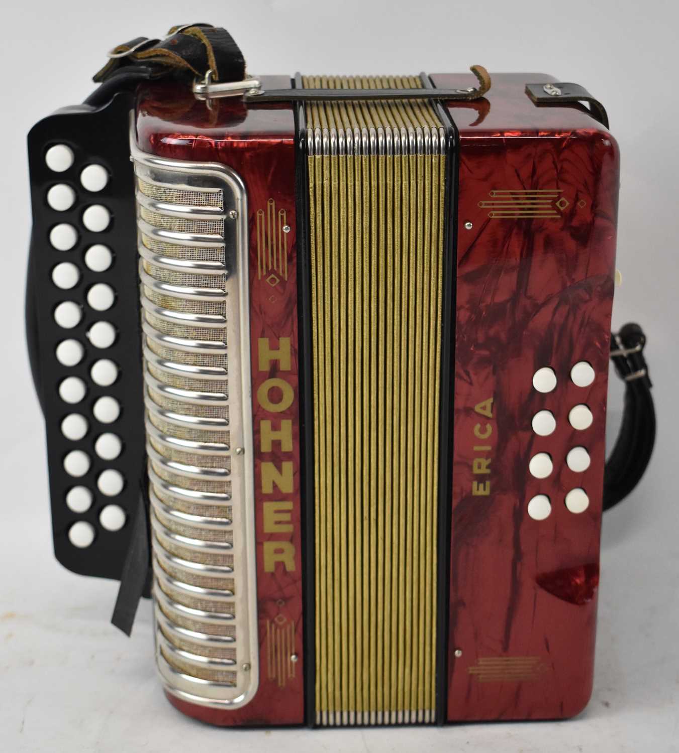 Lot 340 - A Hohner Erica accordion with red marble...