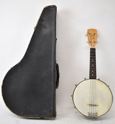 Lot 363 - A 20th century ukulele banjo with brass back,...