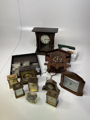 Lot 323 - A quantity of assorted clocks and a box of...