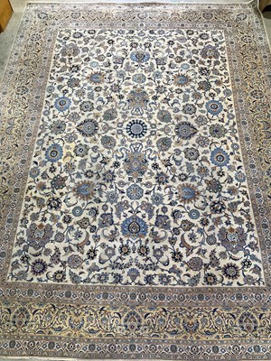 Lot 833 - A Persian designed rug with floral border in...