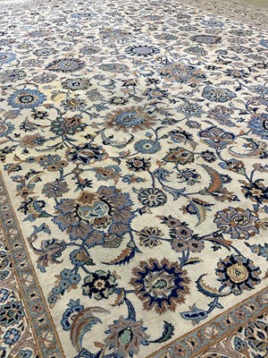 Lot 833 - A Persian designed rug with floral border in...