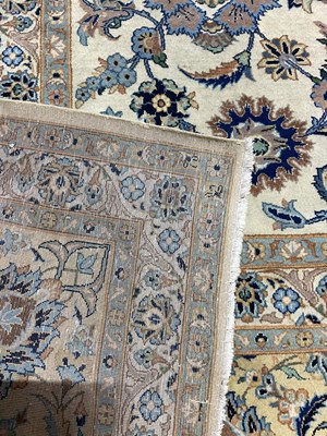 Lot 833 - A Persian designed rug with floral border in...